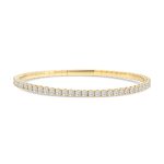 14k yellow gold flexible diamond bangle. - 10894