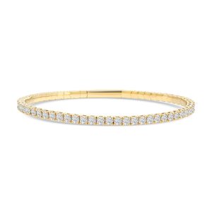 14k yellow gold flexible diamond bangle. - 10894