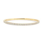 14k yellow gold flexible diamond bangle. - 10894